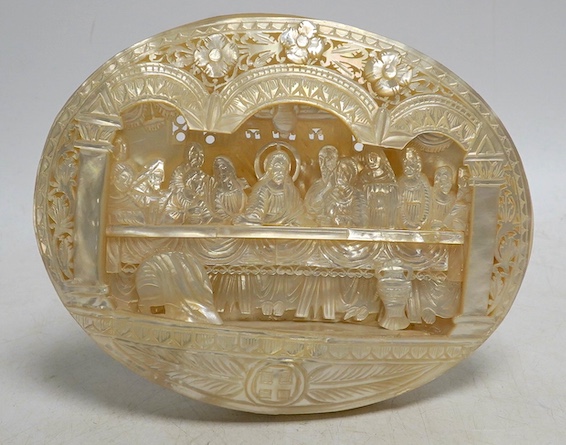 A mother of pearl carved scene of The Last Supper, on easel, 18cm wide. Condition - good